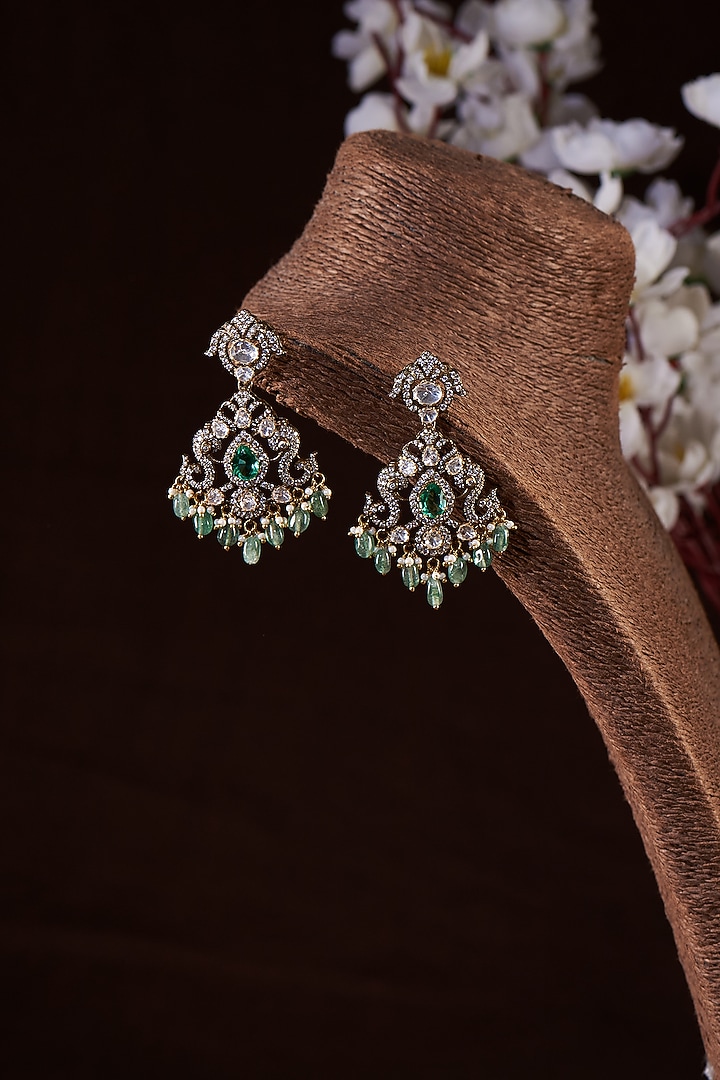 Gold Finish Moissanite Polki & Synthetic Emerald Stud Earrings In Sterling Silver by Hunar at Pernia's Pop Up Shop
