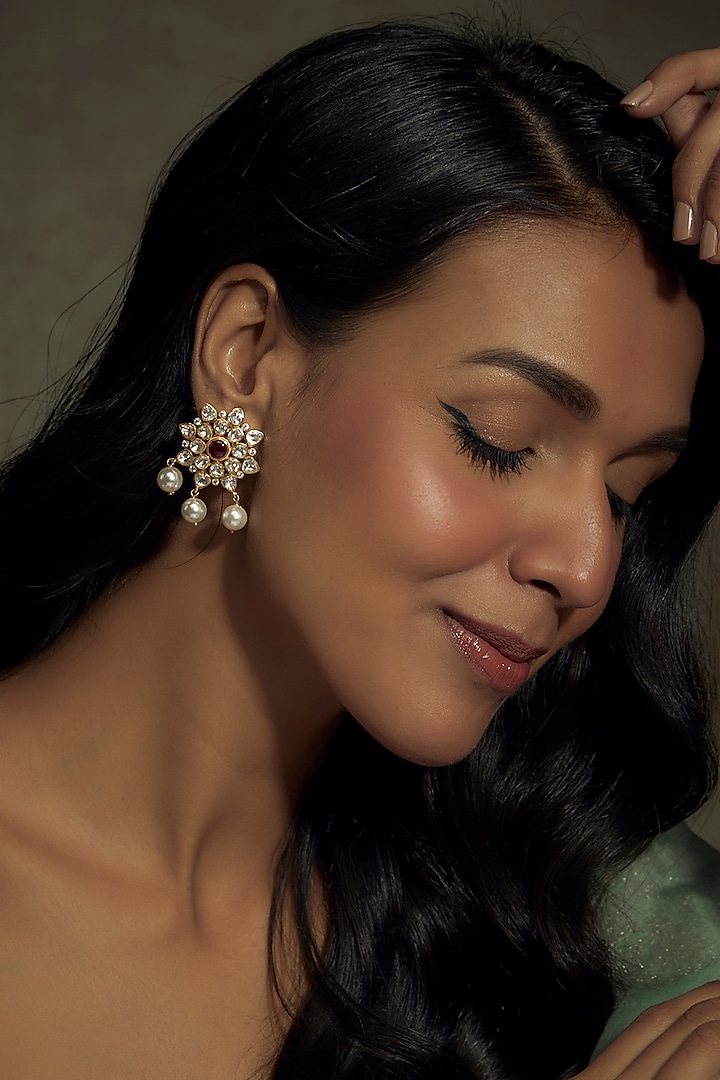 Gold Finish Moissanite Polki & Red Stone Stud Earrings In Sterling Silver by Hunar at Pernia's Pop Up Shop