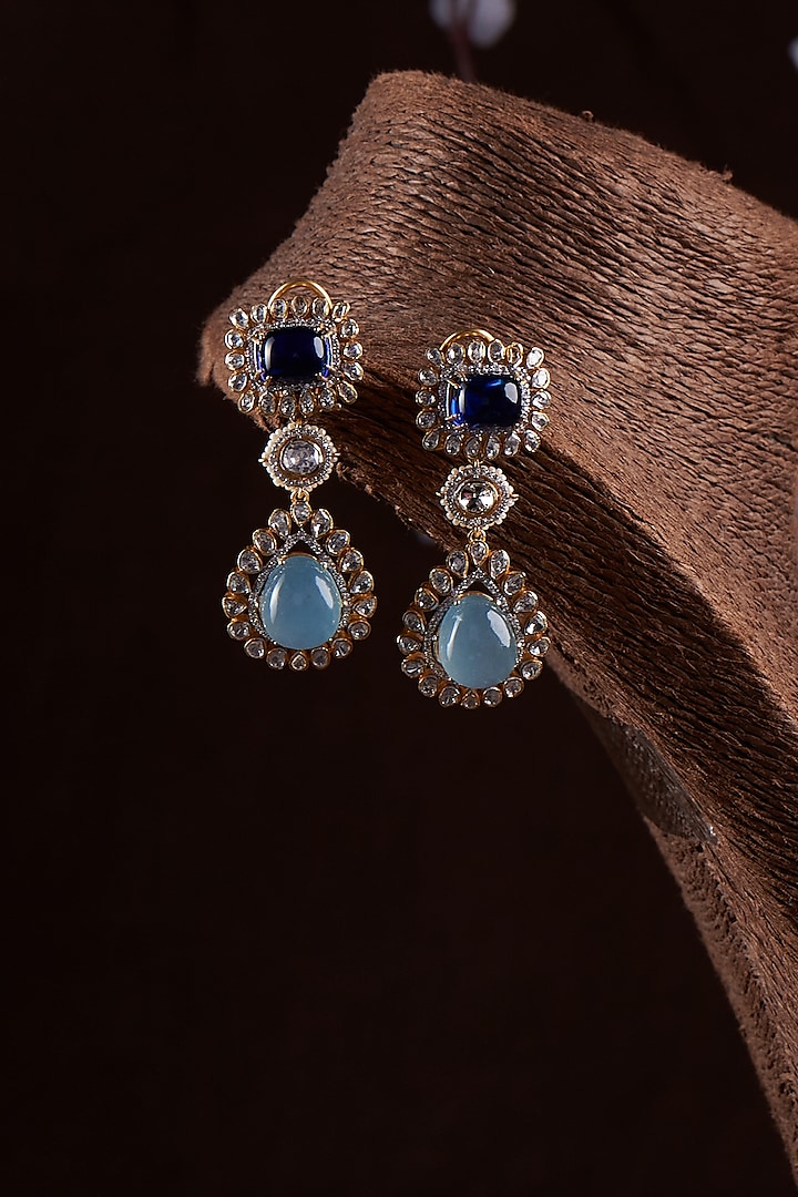 Gold Finish Moissanite Polki & Synthetic Blue Stone Dangler Earrings In Sterling Silver by Hunar at Pernia's Pop Up Shop