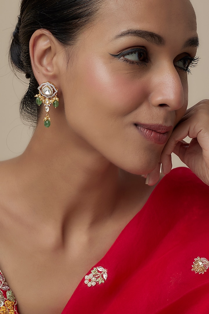 Gold Finish Moissanite Polki & Green Synthetic Stone Dangler Earrings In Sterling Silver by Hunar