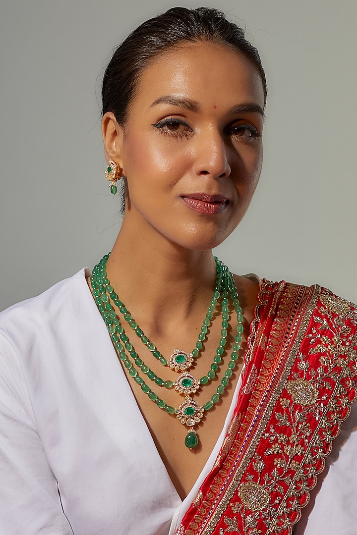 Gold Finish Moissanite Polki & Green Stone Layered Necklace Set In Sterling Silver by Hunar at Pernia's Pop Up Shop