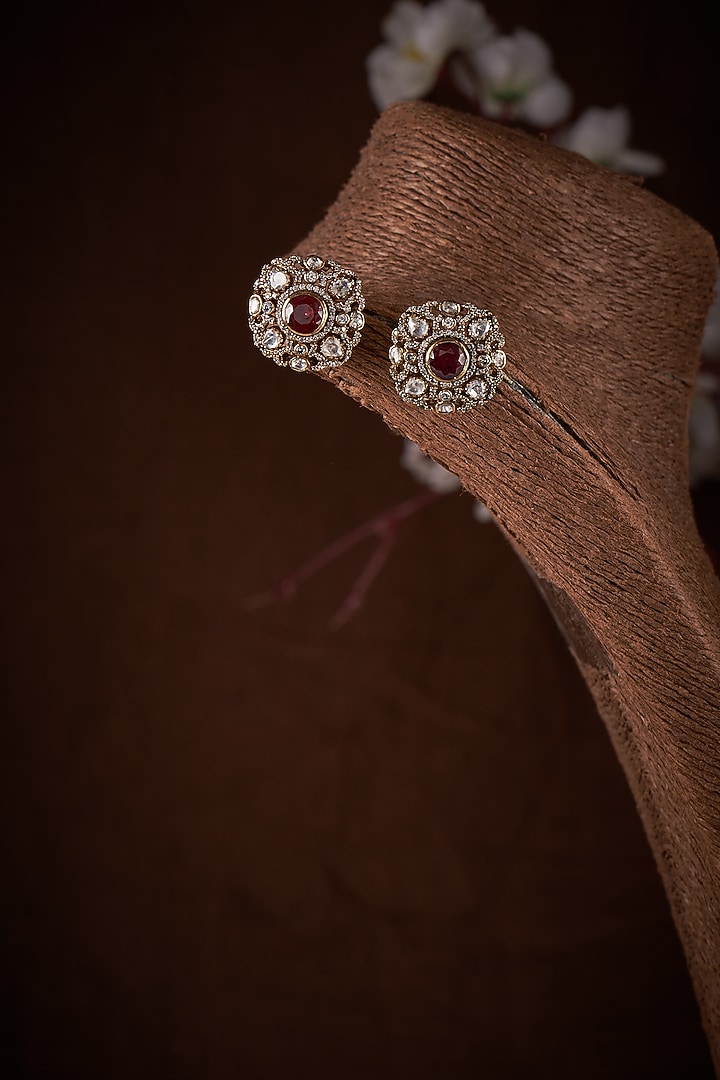 Gold Finish Moissanite Polki & Red Stone Stud Earrings In Sterling Silver by Hunar at Pernia's Pop Up Shop