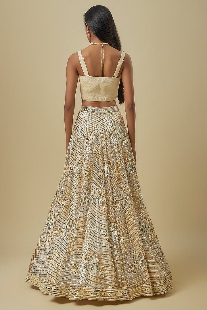 Ivory Gold Silk Shantoon & Hard Net Cape Bridal Lehenga Set by I AM DESIGN at Pernia's Pop Up Shop