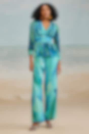 Turquoise Crinkle Chiffon Darla Feather Printed Flared Pants by THE IASO at Pernia's Pop Up Shop