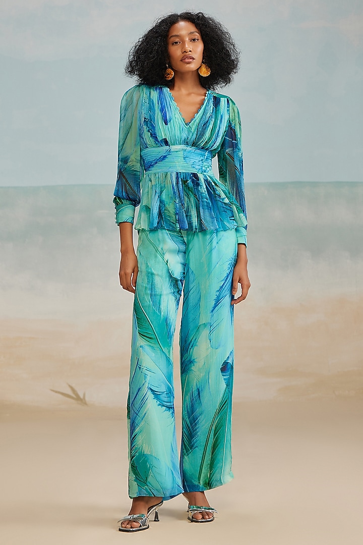 Turquoise Crinkle Chiffon Darla Feather Printed Flared Pants by THE IASO at Pernia's Pop Up Shop