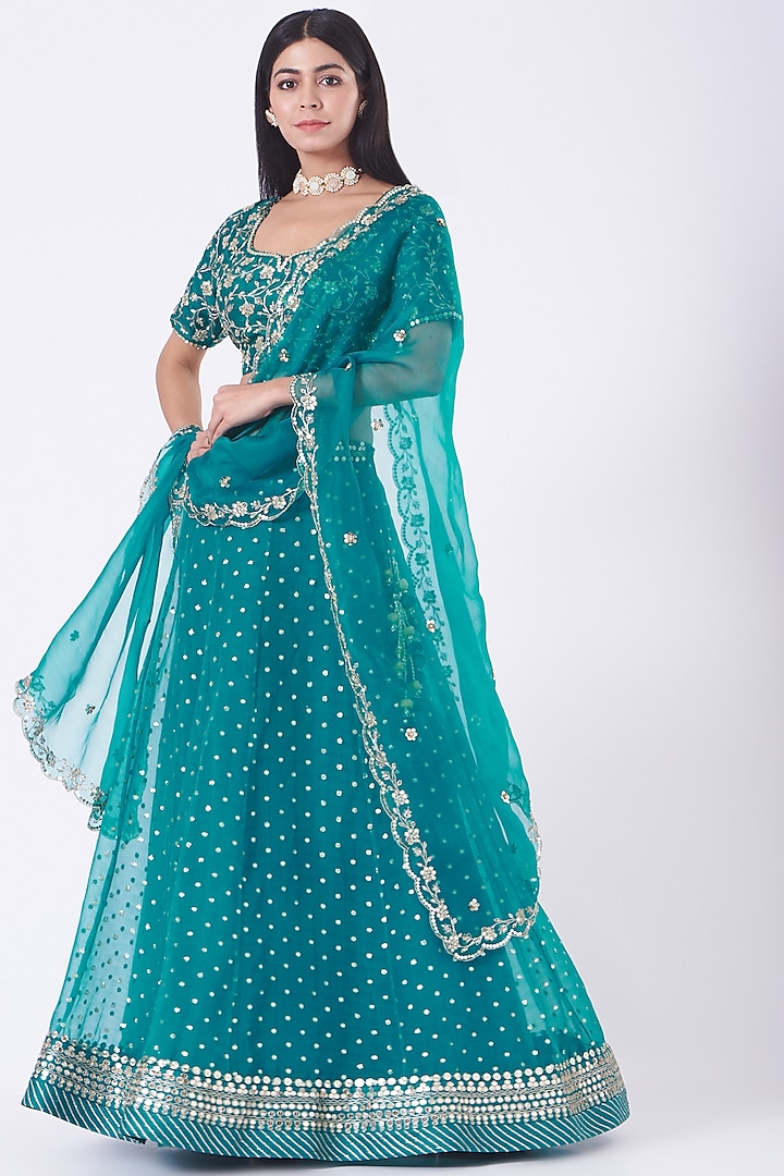 Turquoise Embroidered Lehenga Set by Ivory by dipika