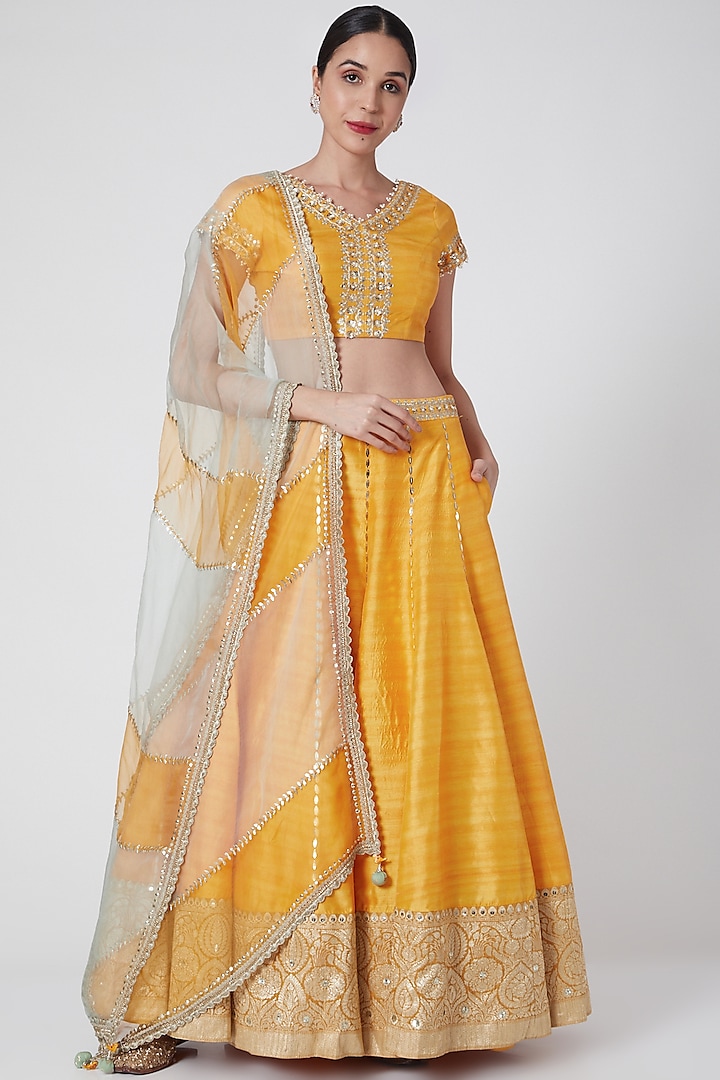 Mustard Embroidered Flared Wedding Lehenga Set by Ivory by dipika at Pernia's Pop Up Shop