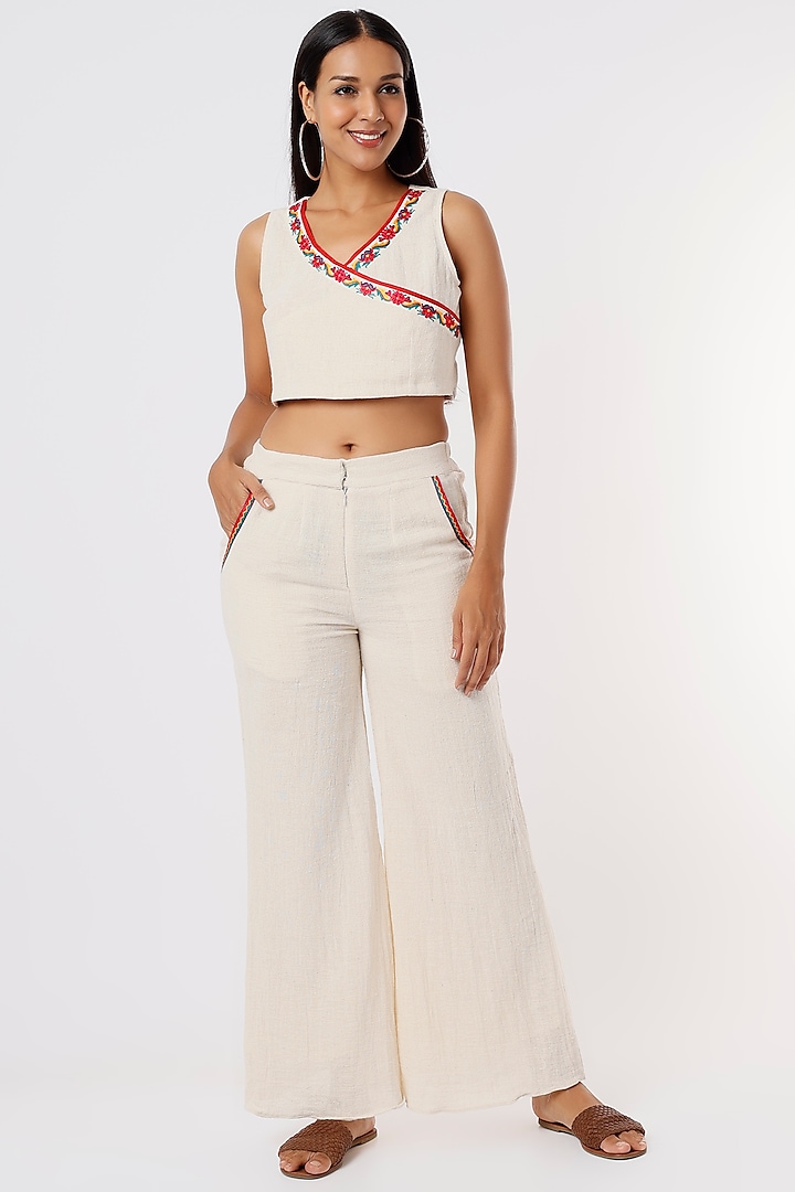 Off-White Aari Embroidered Flared Pants by IKSANA