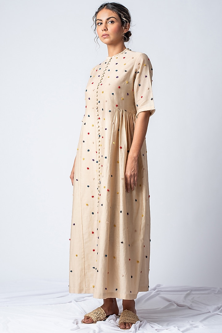 Beige Embroidered Vacation Dress With Rainbow Pom Poms by ILk by Shikha and Vinita at Pernia's Pop Up Shop