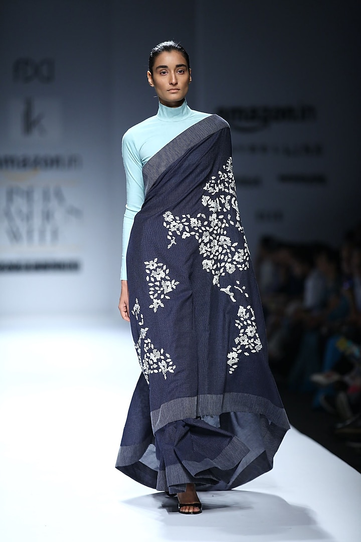 Navy world embroidered sari with ice blue blouse by ILK By Shikha And Vinita