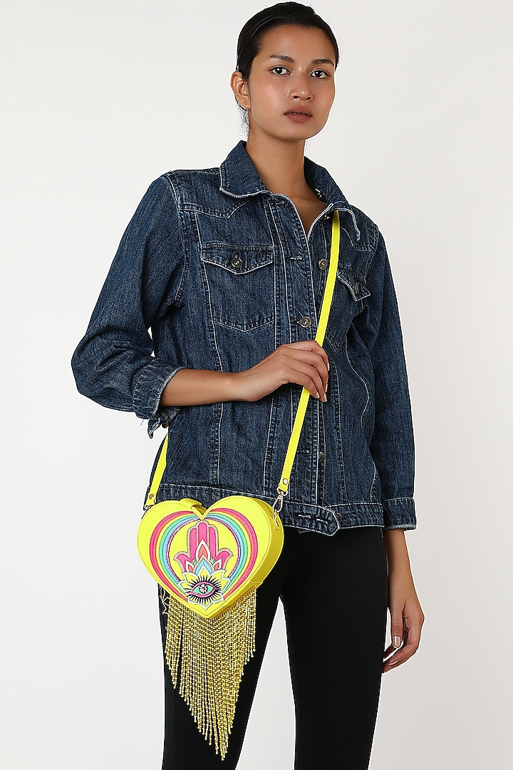 Yellow Rexine Heart Shaped Bag by Manish Arora