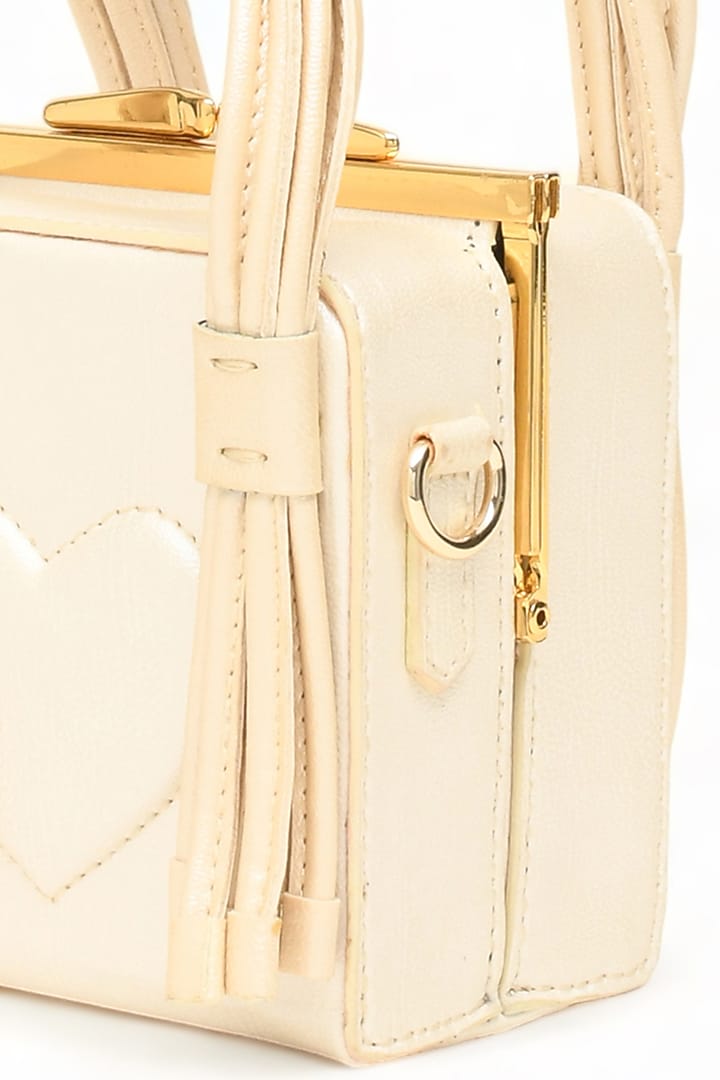 White Faux Leather Love Knot Cube Handbag by Immri at Pernia's Pop Up Shop