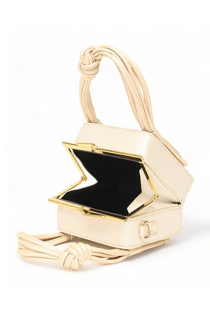 White Faux Leather Love Knot Cube Handbag by Immri at Pernia's Pop Up Shop