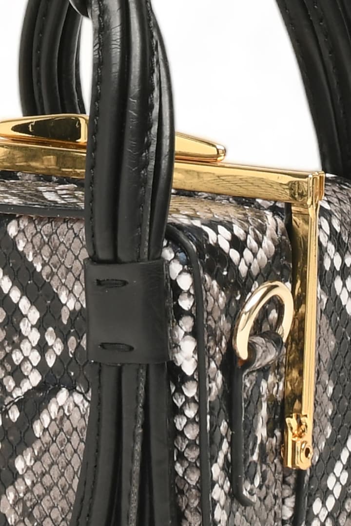 Black Faux Leather Love Knot Cube Handbag by Immri at Pernia's Pop Up Shop