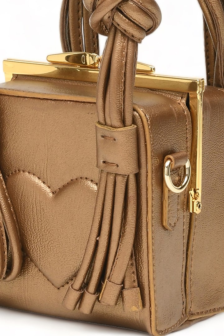 Gold Faux Leather Love Knot Cube Handbag by Immri at Pernia's Pop Up Shop