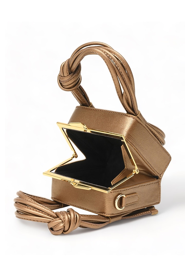 Gold Faux Leather Love Knot Cube Handbag by Immri at Pernia's Pop Up Shop
