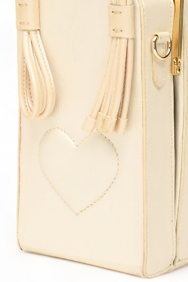 White Faux Leather Love Knot Cuboid Handbag by Immri at Pernia's Pop Up Shop