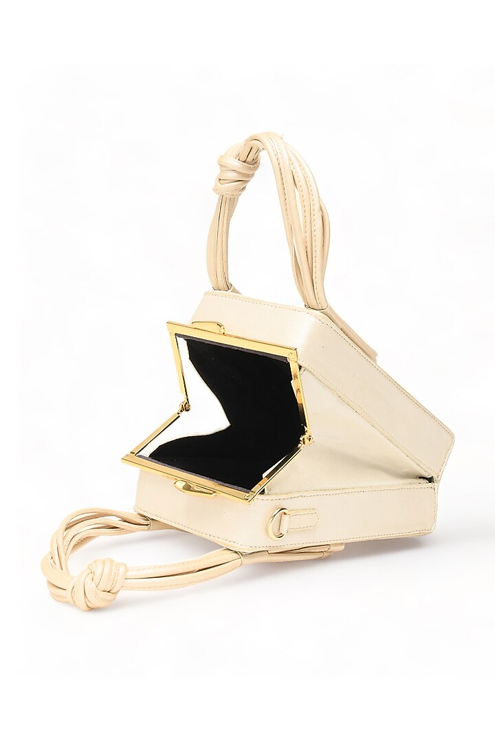 White Faux Leather Love Knot Cuboid Handbag by Immri at Pernia's Pop Up Shop