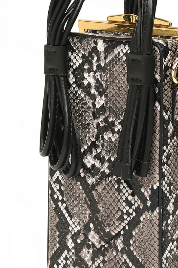 Black Faux Leather Love Knot Cuboid Handbag by Immri at Pernia's Pop Up Shop