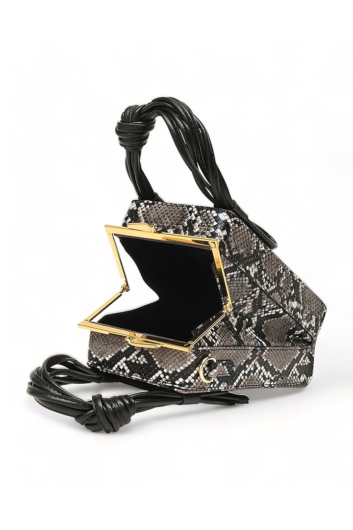 Black Faux Leather Love Knot Cuboid Handbag by Immri at Pernia's Pop Up Shop