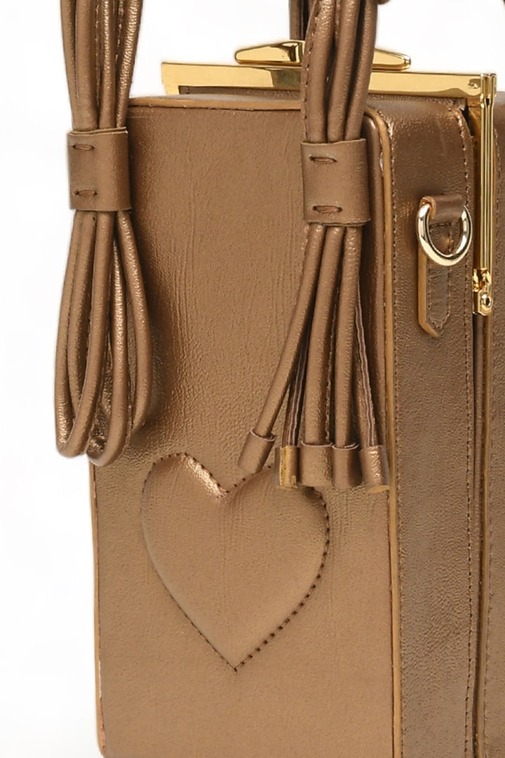 Gold Faux Leather Love Knot Cuboid Handbag by Immri at Pernia's Pop Up Shop