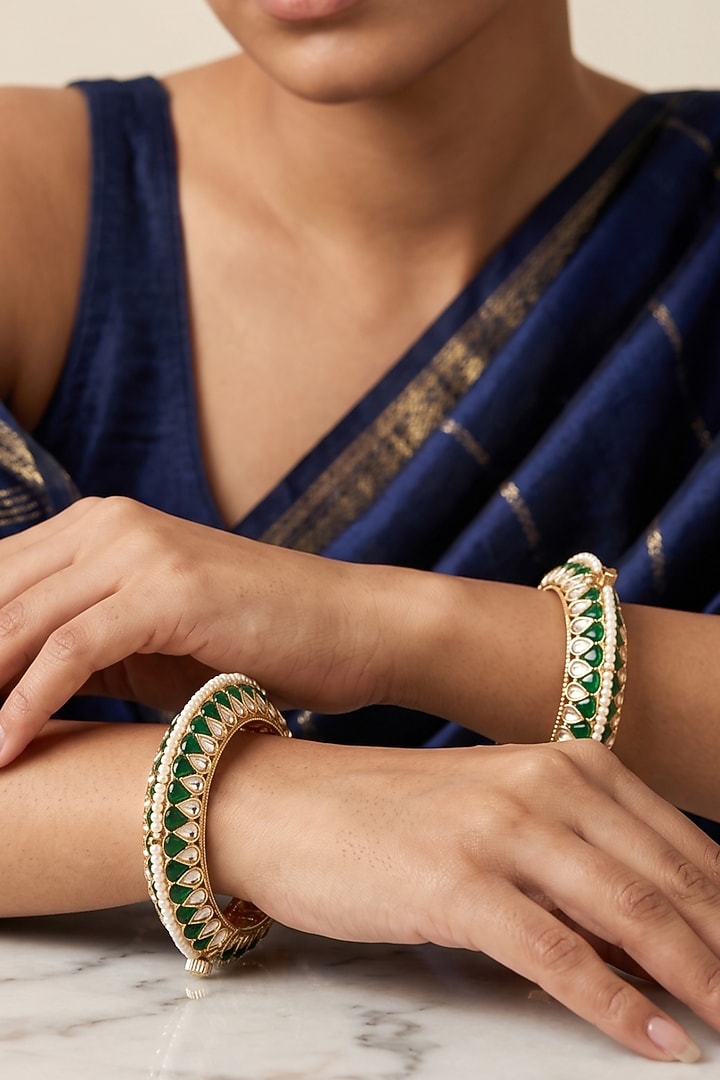 Gold Finish Kundan Polki & Green Enameled Bangles (Set Of 2) by IndieBlingz at Pernia's Pop Up Shop