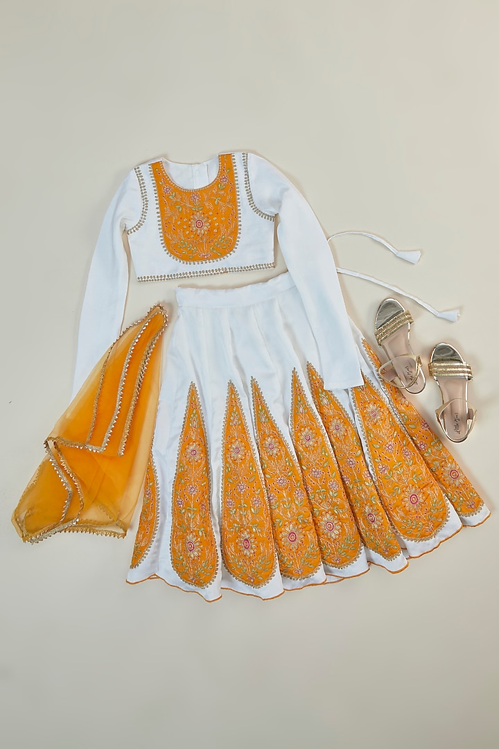 Off-White & Yellow Silk Applique Embroidered Lehenga Set For Girls by Inspired Needleworks at Pernia's Pop Up Shop