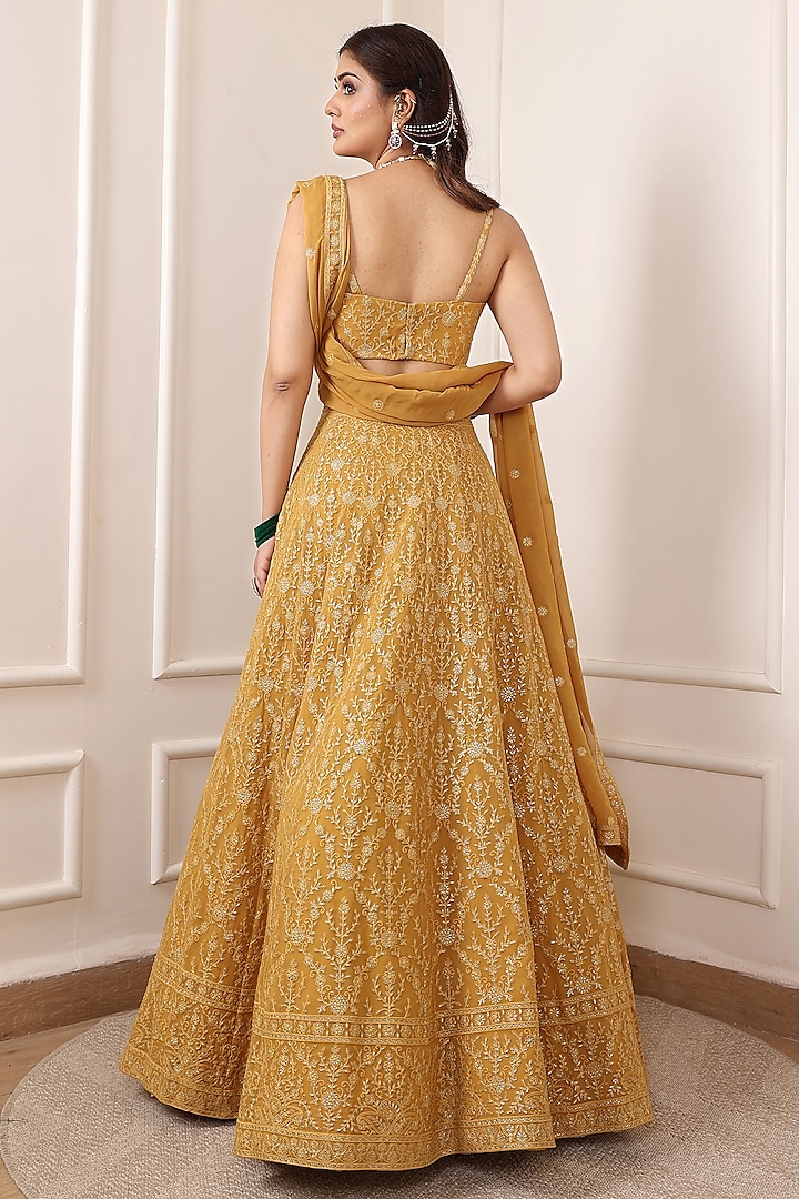 Mustard Yellow Georgette Thread & Floral Motif Embroidered Wedding Lehenga Set by Indian Wardrobe at Pernia's Pop Up Shop
