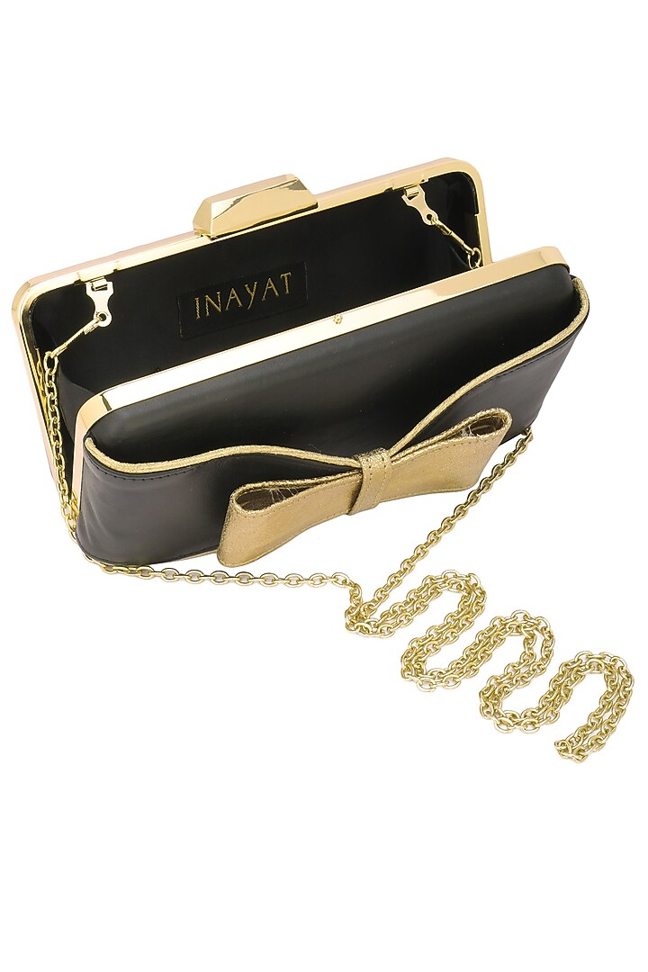 Black and gold hand bow clutch available only at Pernia's Pop Up Shop.