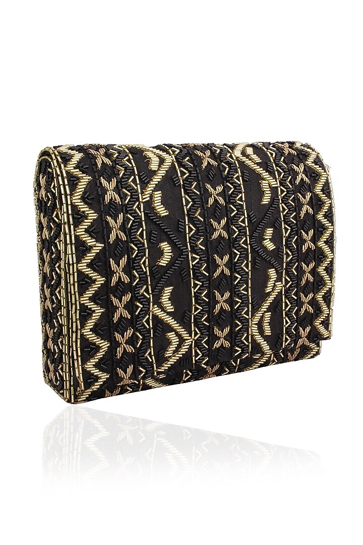 Inayat presents Black and gold zigzag embroidered flapover clutch available only at Pernia's Pop Up Shop.