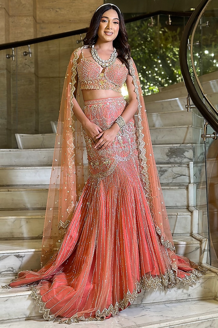 Coral Pink Net Embroidered Fish-Cut Lehenga Set by Isa by Dolly Wahal