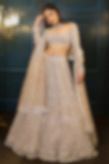Nude Net Floral Embroidered Bridal Lehenga Set by Isa by Dolly Wahal at Pernia's Pop Up Shop