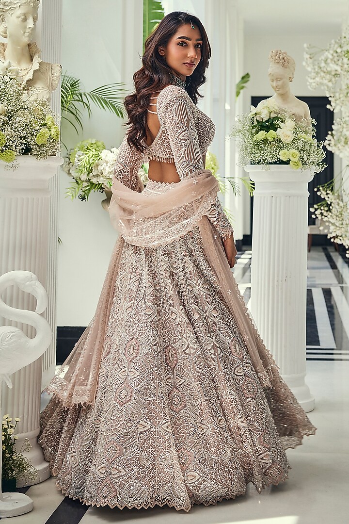 Dusty Pink Net Cutdana Embellished Bridal Lehenga Set by Isa by Dolly Wahal at Pernia's Pop Up Shop