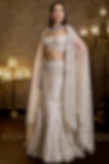 Ivory Net Hand Embroidered Fish-Cut Bridal Lehenga Set by Isa by Dolly Wahal at Pernia's Pop Up Shop