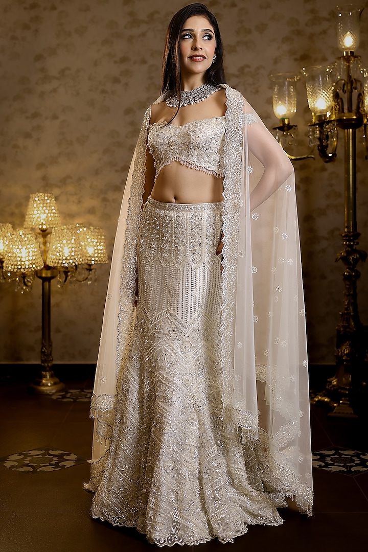 Ivory Net Hand Embroidered Fish-Cut Bridal Lehenga Set by Isa by Dolly Wahal at Pernia's Pop Up Shop