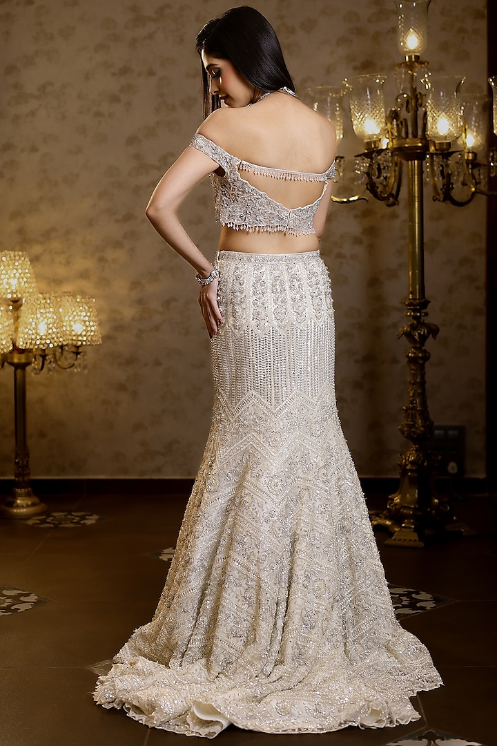 Ivory Net Hand Embroidered Fish-Cut Bridal Lehenga Set by Isa by Dolly Wahal at Pernia's Pop Up Shop