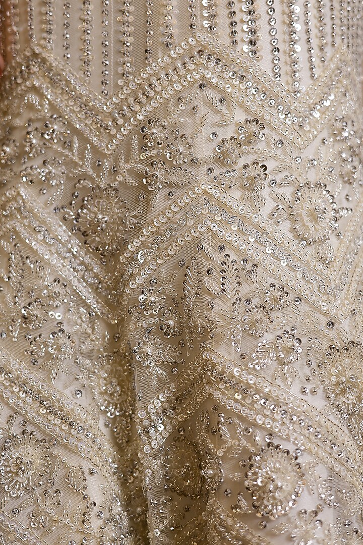 Ivory Net Hand Embroidered Fish-Cut Bridal Lehenga Set by Isa by Dolly Wahal at Pernia's Pop Up Shop