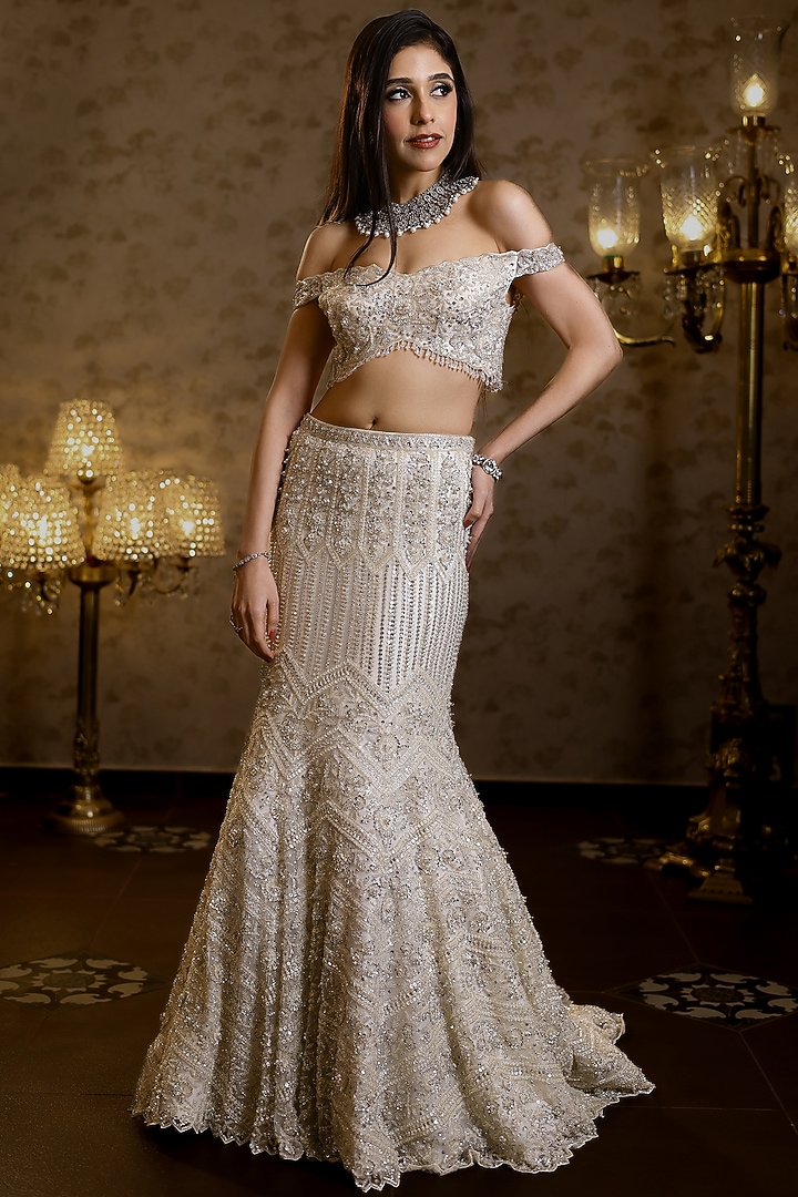 Ivory Net Hand Embroidered Fish-Cut Bridal Lehenga Set by Isa by Dolly Wahal at Pernia's Pop Up Shop