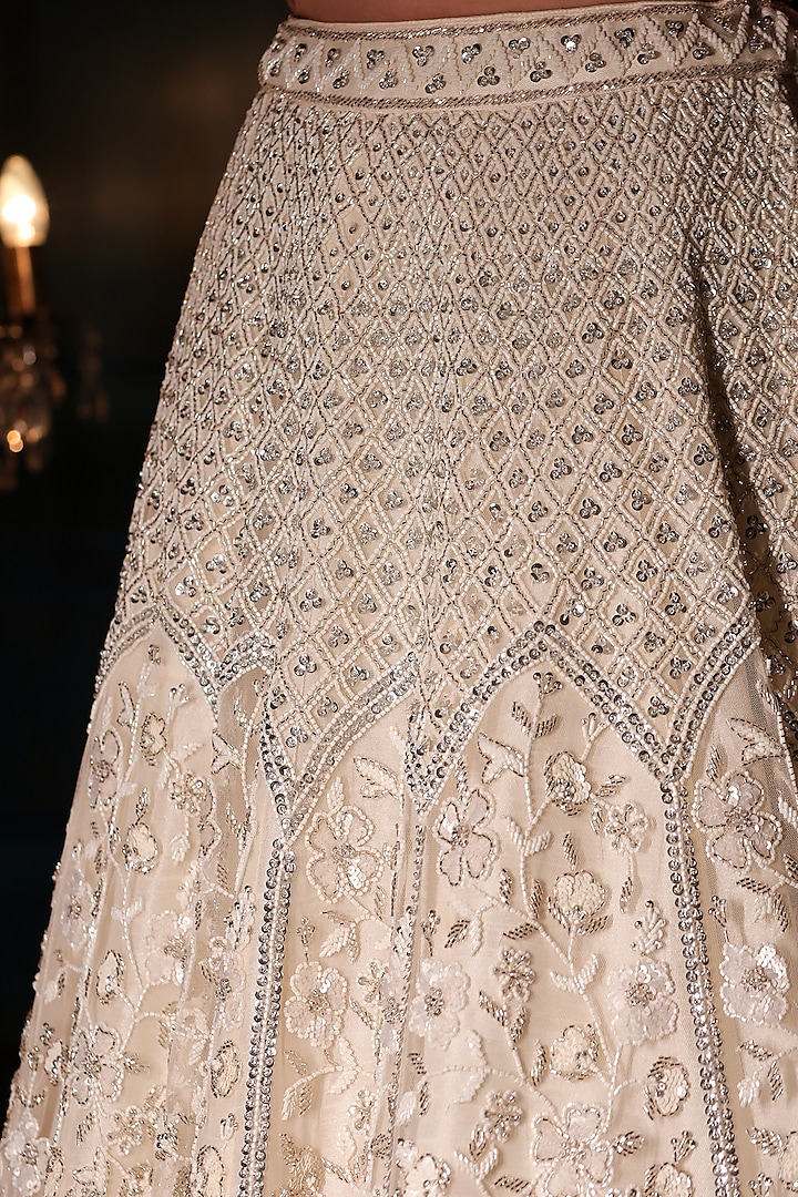 Ivory Net Sequins & Pearl Embroidered Bridal Lehenga Set by Isa by Dolly Wahal at Pernia's Pop Up Shop