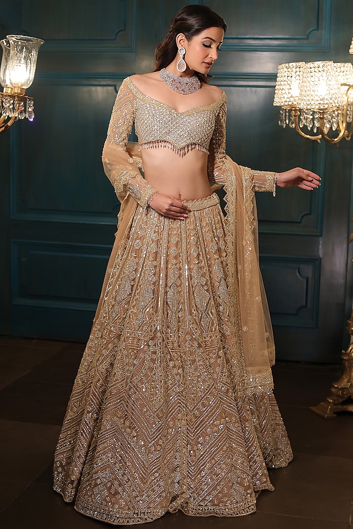 Light Gold Net Sequins Embroidered Lehenga Set by Isa by Dolly Wahal