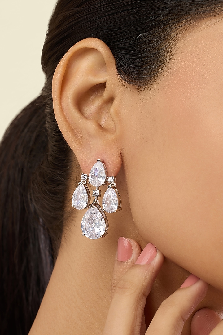 White Rhodium Finish Crystal Zirconia Dangler Earrings by Isharya at Pernia's Pop Up Shop