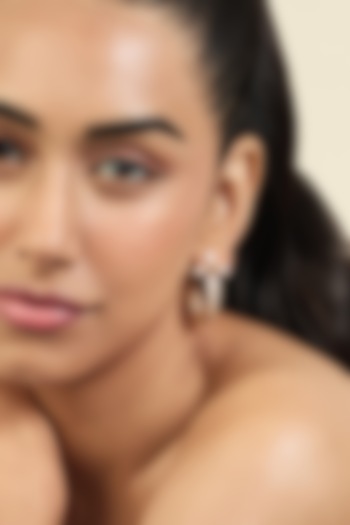 Gold Plated Mirror Tennis Twisted Sword Dangler Earrings by Isharya at Pernia's Pop Up Shop