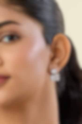 White Rhodium Finish White Synthetic Stone Stud Earrings by Isharya at Pernia's Pop Up Shop
