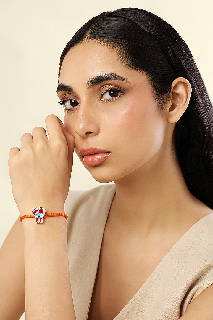 Gold Plated Divine Charm Red & Blue Enameled Bracelet by Isharya at Pernia's Pop Up Shop
