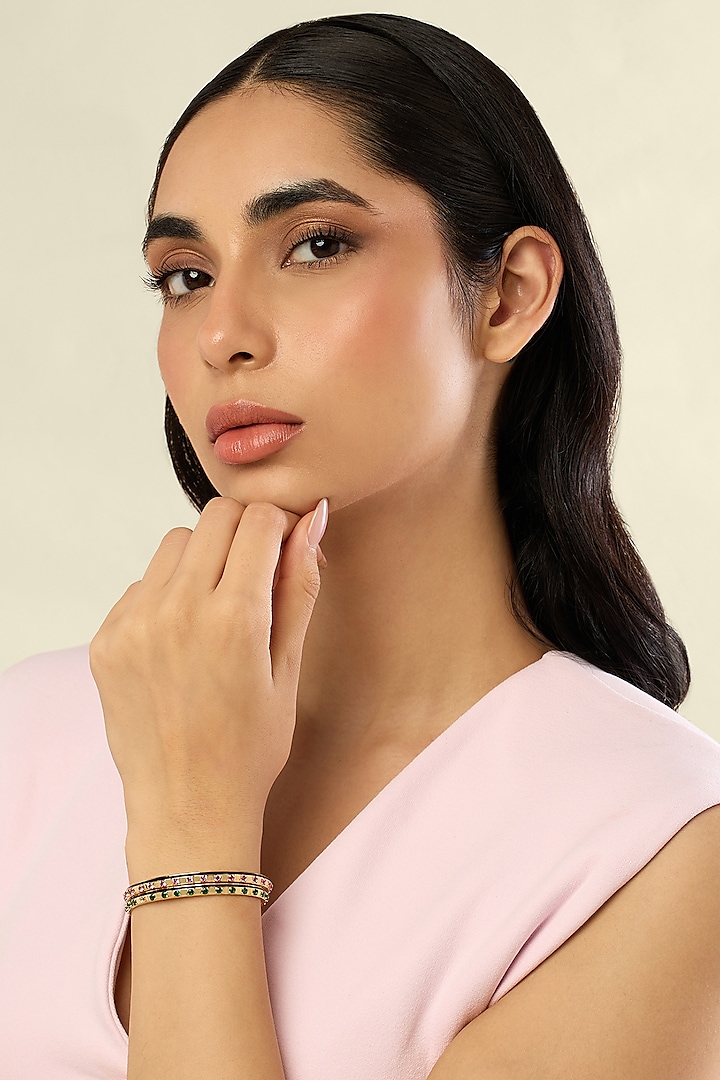 Gold Plated Pink & Green Crystal Zirconia Black Enameled Cuffs (Set Of 2) by Isharya at Pernia's Pop Up Shop
