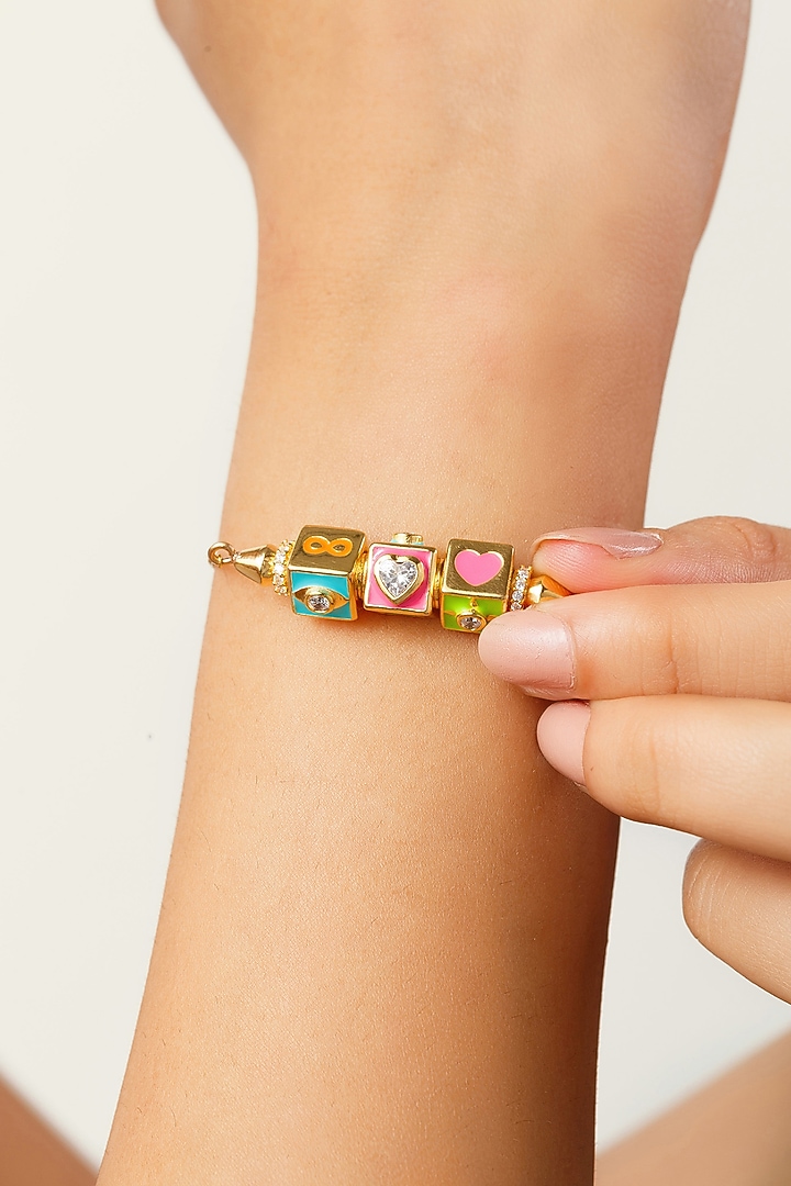 Gold Plated Pink Synthetic Stone & CZ Fidgeting Heart Bracelet by Isharya at Pernia's Pop Up Shop