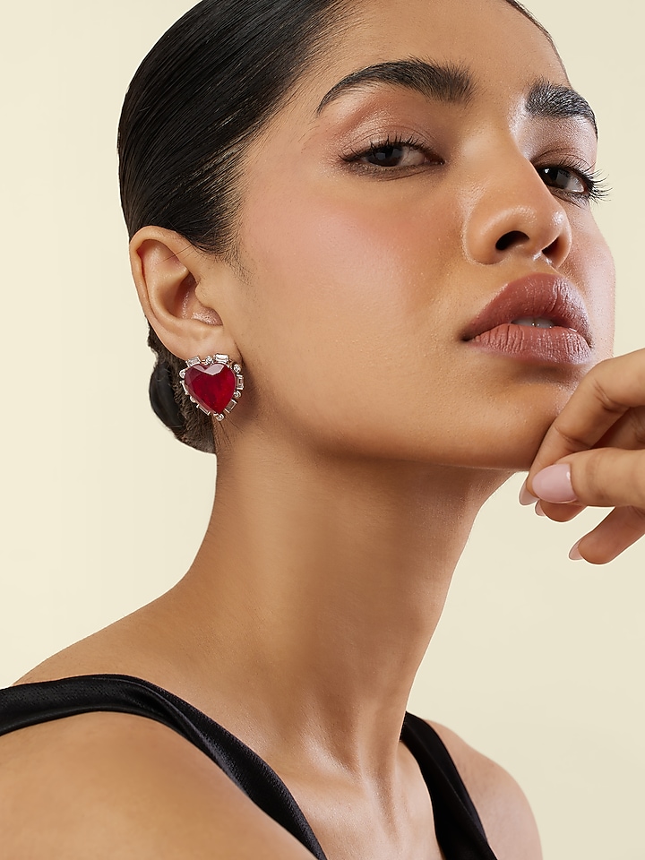 White Rhodium Finish Crystal Zircon & Ruby Doublet Stone Heart Stud Earrings by Isharya at Pernia's Pop Up Shop