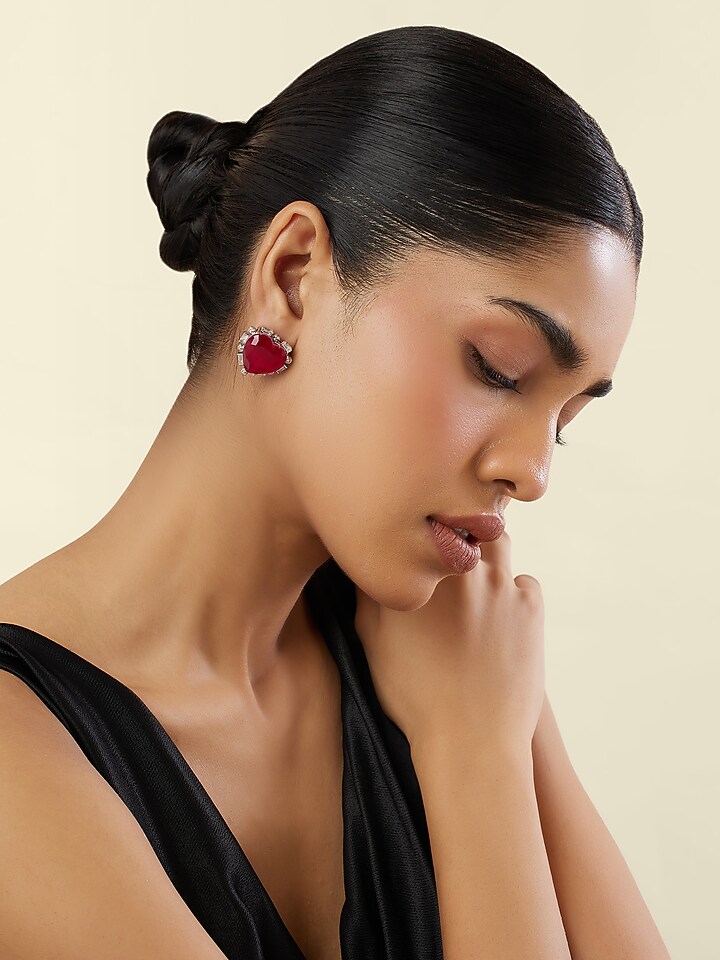 White Rhodium Finish Crystal Zircon & Ruby Doublet Stone Heart Stud Earrings by Isharya at Pernia's Pop Up Shop