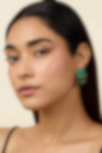 Gold Plated Emerald Synthetic Stone Huggie Hoop Earrings by Isharya at Pernia's Pop Up Shop