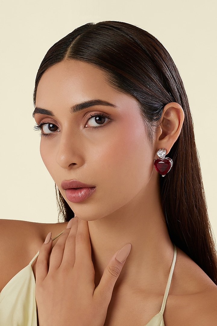 White Rhodium Finish Ruby Gemstone Stud Earrings by Isharya at Pernia's Pop Up Shop